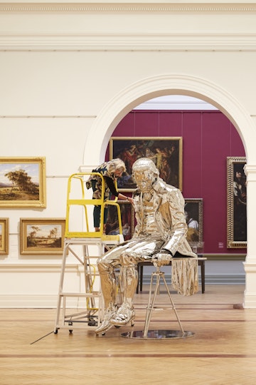 Objects conservator Kerry Head cleans Michael Parekowhai's 2015 sculpture The English Channel. 