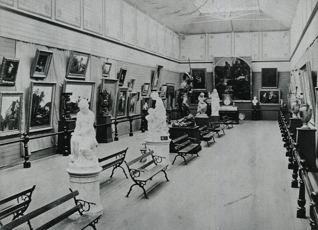 1881 photograph of the interior of the Art Gallery of New South Wales showing (at the end of the gallery) Ford Maddox Brown's painting 'Chaucer at the court of Edward III'