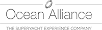 Black sans serif letters 'Ocean Alliance' between two horizontal lines. Above the lines is a small ring, and below the lines in smaller capital letters is the slogan 'The superyacht experience company'.