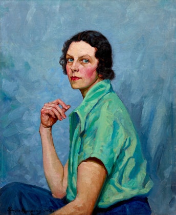 A portrait of a seated person, with blue eyes, rosy cheeks and lips, and chin-length dark hair, wearing a short-sleeved green shirt