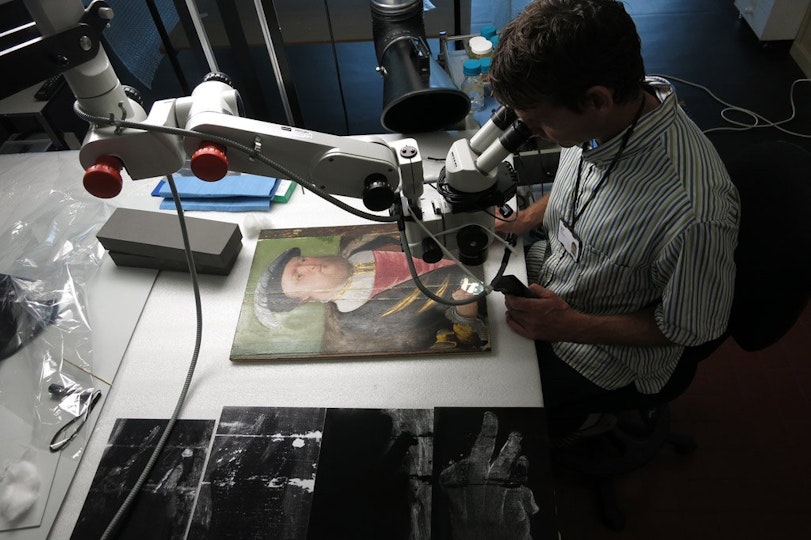 Paintings Conservator Simon Ives investigates King Henry VIII prior to treatment. Project supported by the Conservation Benefactors. 