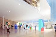A gallery space with a large white overhanging structure and light pouring in through an enormous glass wall, which has views to a grassed space with a low building.
