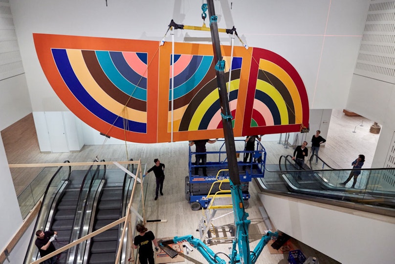 The artwork was then lifted into its final position.