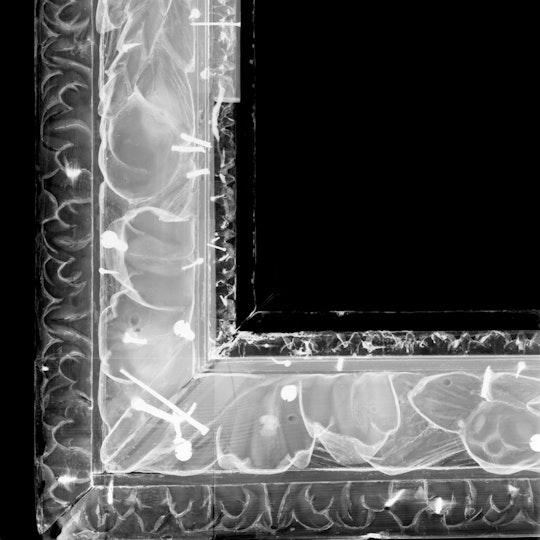 An x-ray of the frame shows the internal construction, including the nails and tacks used to attach the ornaments.