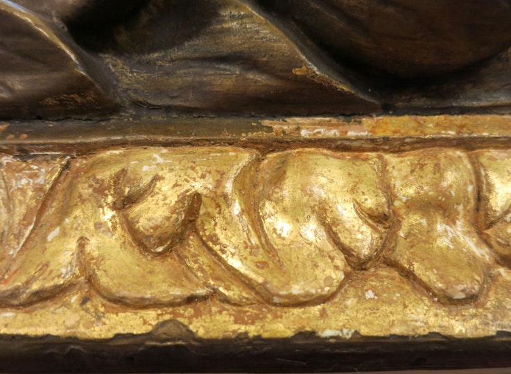 The original gilding was revealed after the non-original layers were removed.