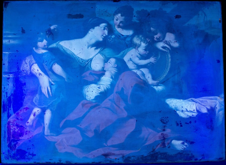 A view of the painting under ultra-violet light shows the fluorescing aged natural resin coat and absorbent (dark) old retouchings.