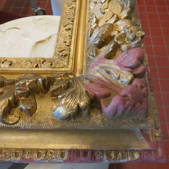 The right lower corner of the frame in-painted in preparation for in-gilding. The surrounded areas show the well-preserved original gilding, which had been revealed from under the layers of overpaint. 