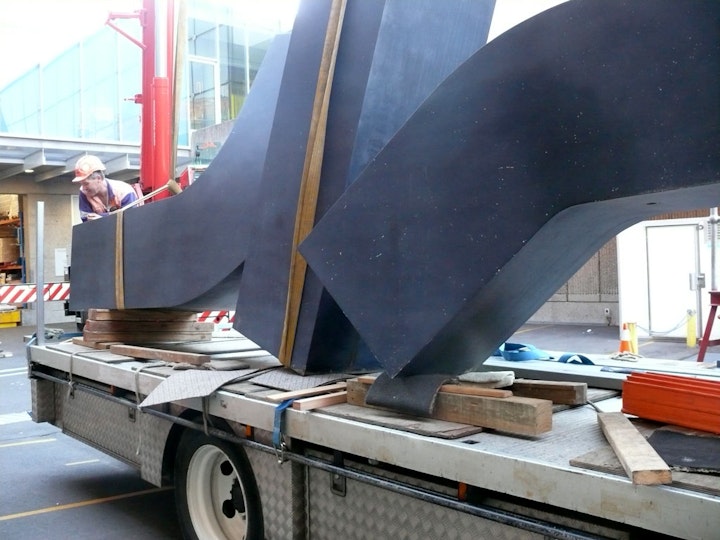 Resting on supports on the back of the truck that would take it to Melbourne for treatment. Experts there have worked successfully on other Meadmore outdoor sculptures that had suffered similar problems.