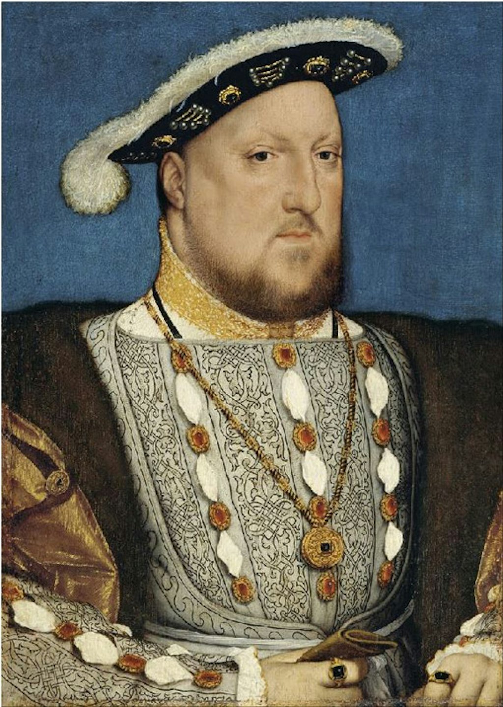 The head and torso of a bearded man wearing a hat and clothes, both trimmed with fur, and a ring on each hand.