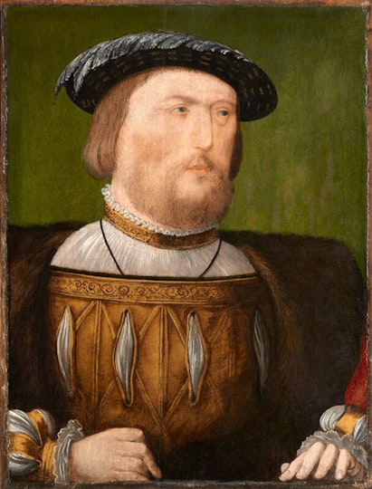 The head and torso of a bearded man wearing hat and fine clothes of velvet and fur. His hair is chin-length.