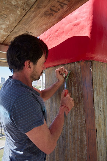 Michael Brown, the Gallery’s senior preparator, painstakingly removed some of the varnish by hand.