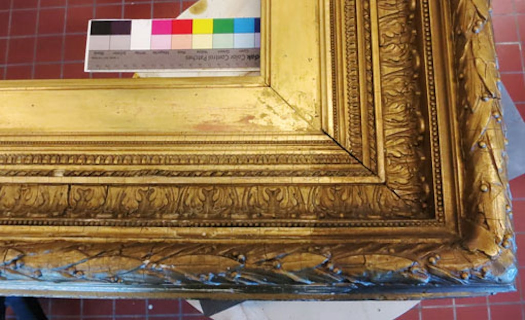 During treatment, the difference between the original gilding and the oxided brass-based overpaint is stark