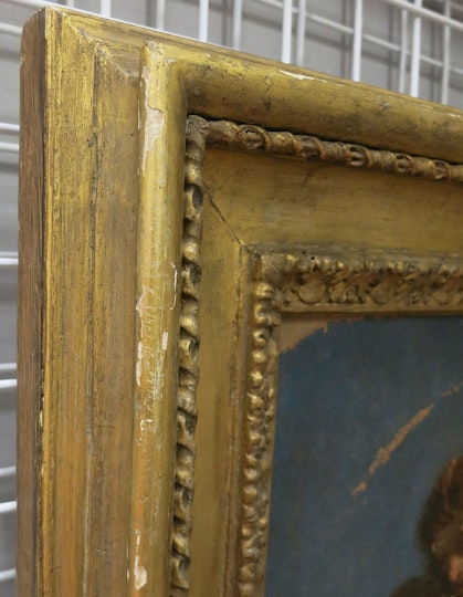 A detail of the frame before conservation treatment