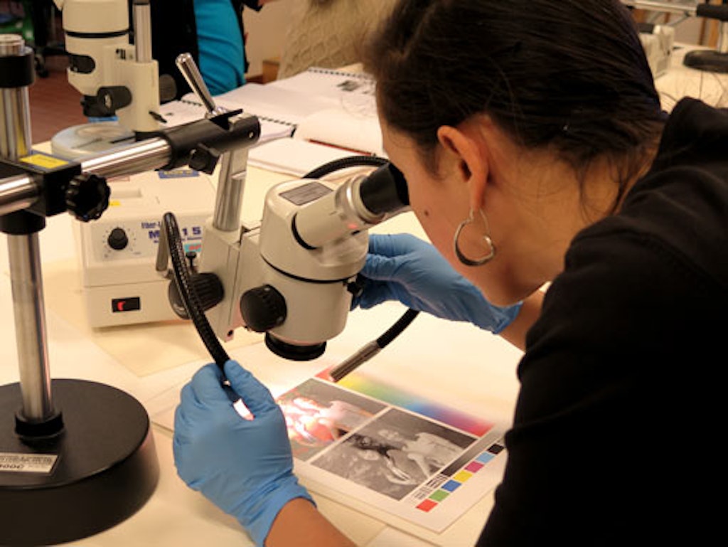 Examining a digital sample print with a stereo microscope