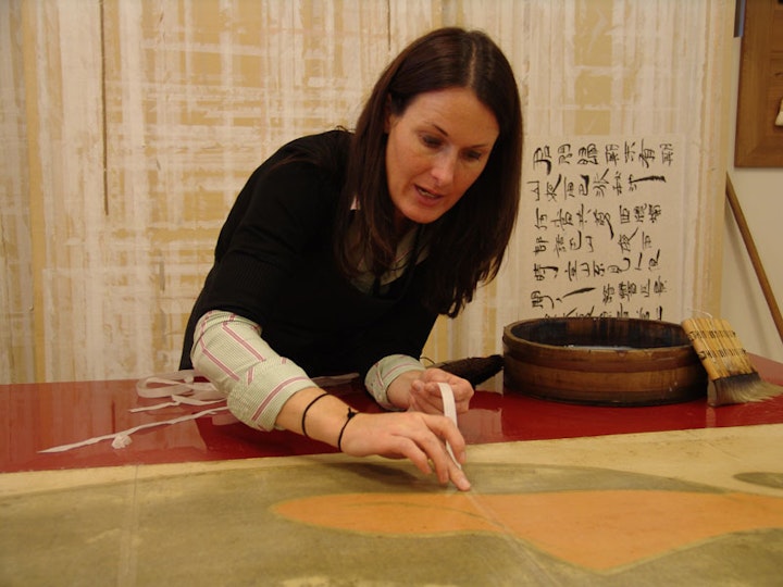 h3. Repairing
Strips of Japanese kozo paper, attached using Japanese wheat starch paste, were used to repair tears, pinholes and other areas of paper loss and to provide extra strength along the poster folds.