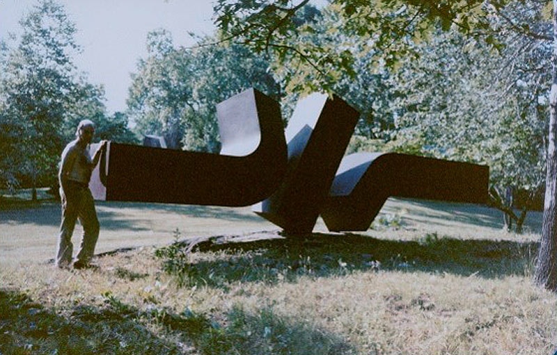 Artist Clement Meadmore with ??Flippant flurry?? in the USA before it was shipped to Australia.