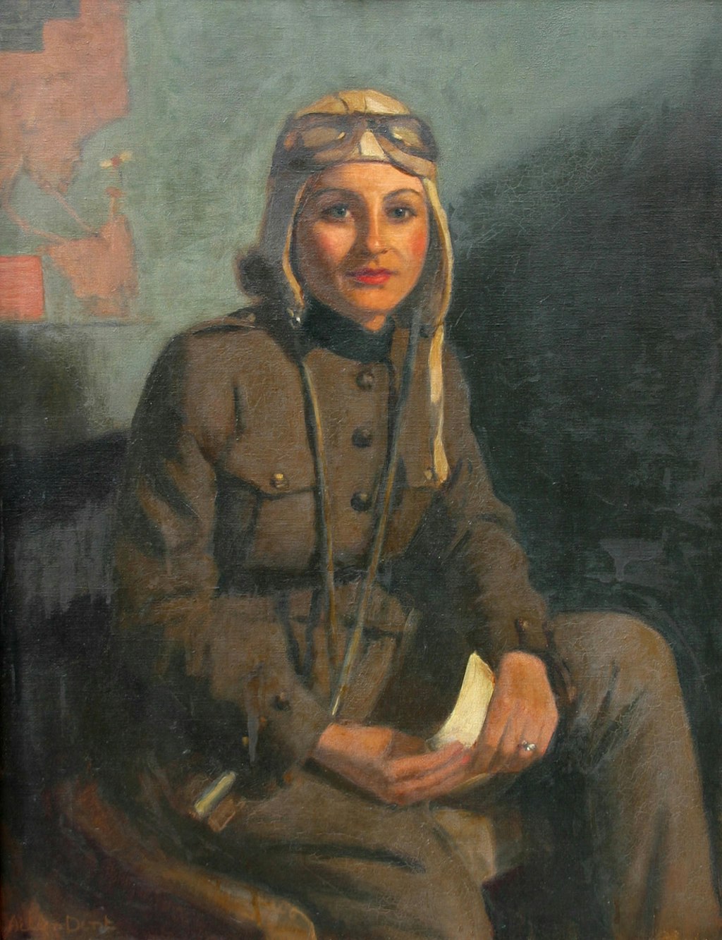 Seated woman wearing aviator's overalls and unstrapped flying helmet with goggles perched on her forehead. She is holding a piece of paper in her hands.