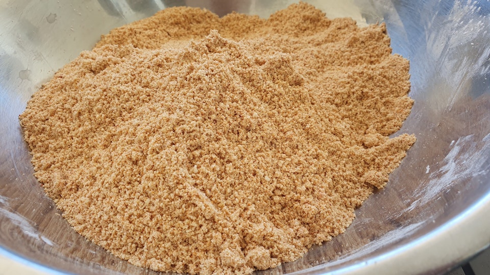 A mound of dry crumb in the bottom of a bowl.