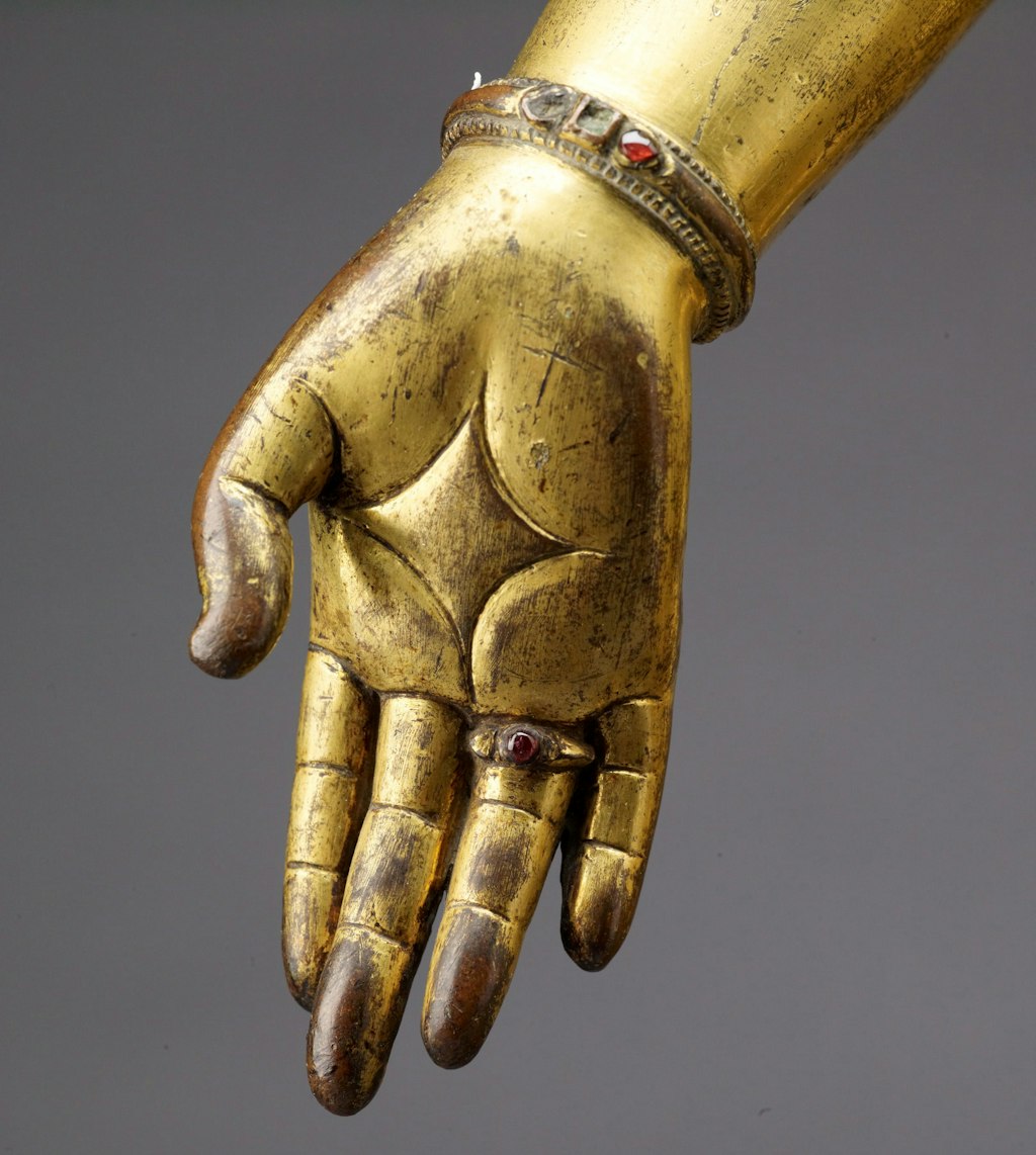 Padmapani’s right hand, in the gesture of wish-granting