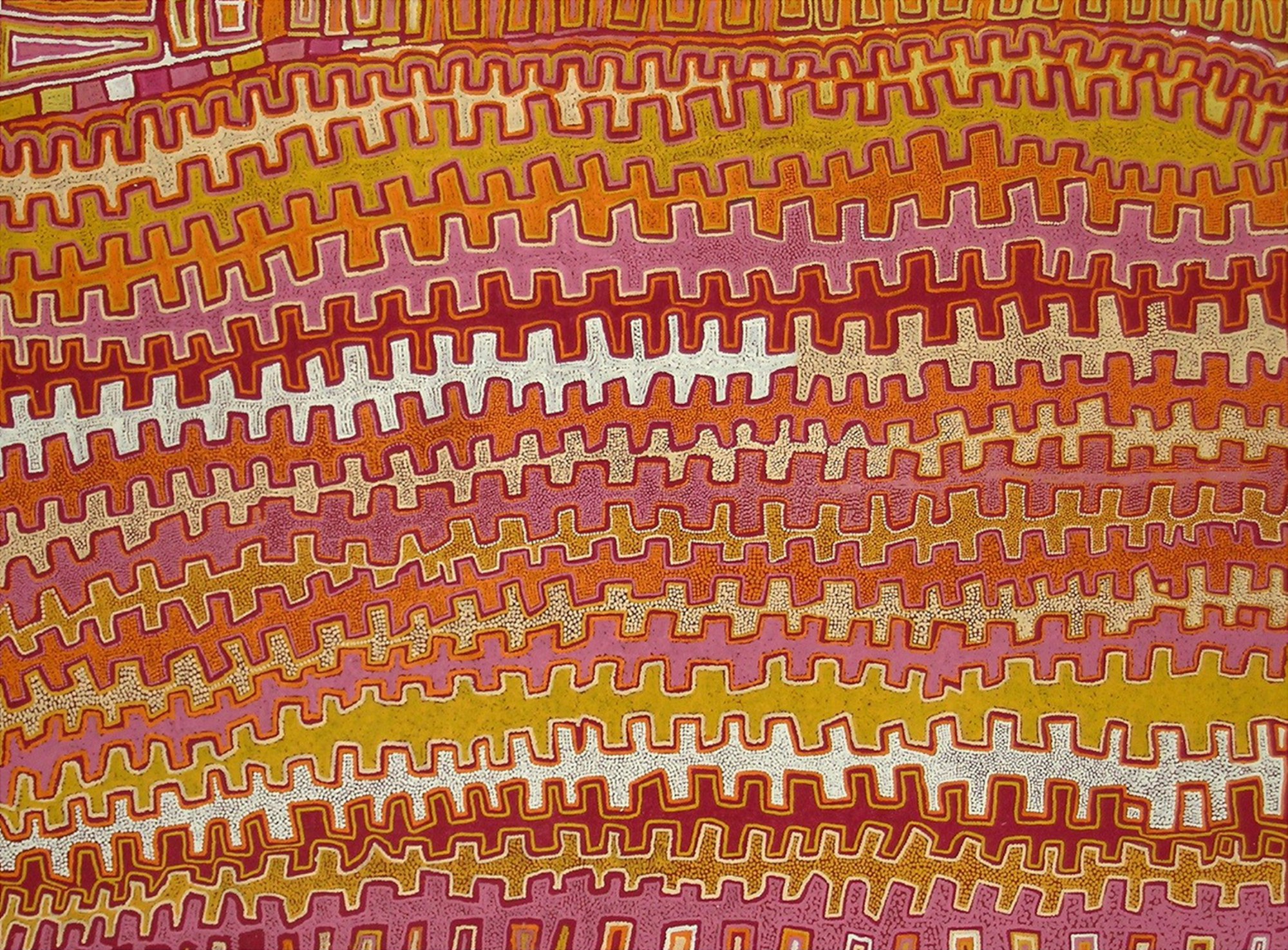Interlocking saw-toothed lines in shades of orange, pink, red and yellow.