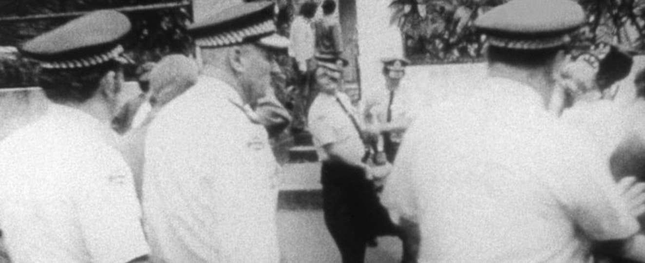 Three police officers viewed from behind.