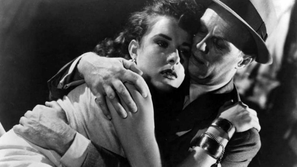 Two people embrace one another.