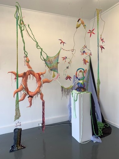 Jacquie Meng  Age 23, Watson, ACT  My world, your world 2021  wool, beads, wire, oven-bake clay, resin, string, fabric 