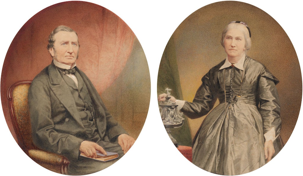 Two oval portraits. One of a seated man in a three-piece suit; the other of a standing woman in a voluminous long-sleeved dress.