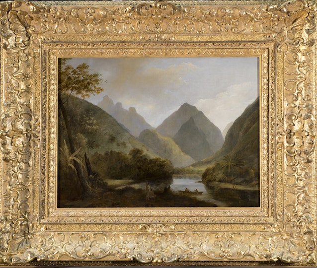 A landscape painting of a body of water among green peaks, within an ornate gold frame.