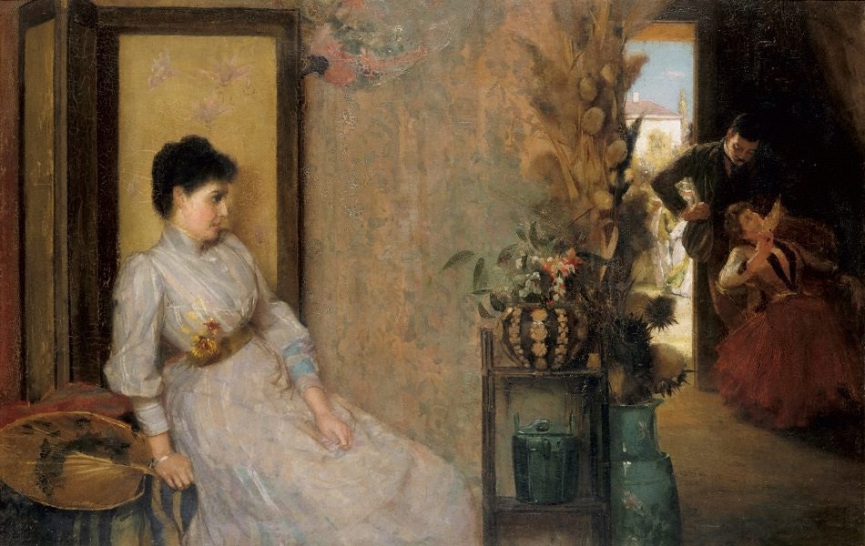 A person wearing a high-coloured long dress is seated next to a wall in a room while around the corner a person in a suit leans over and touches a seated person in a dress.