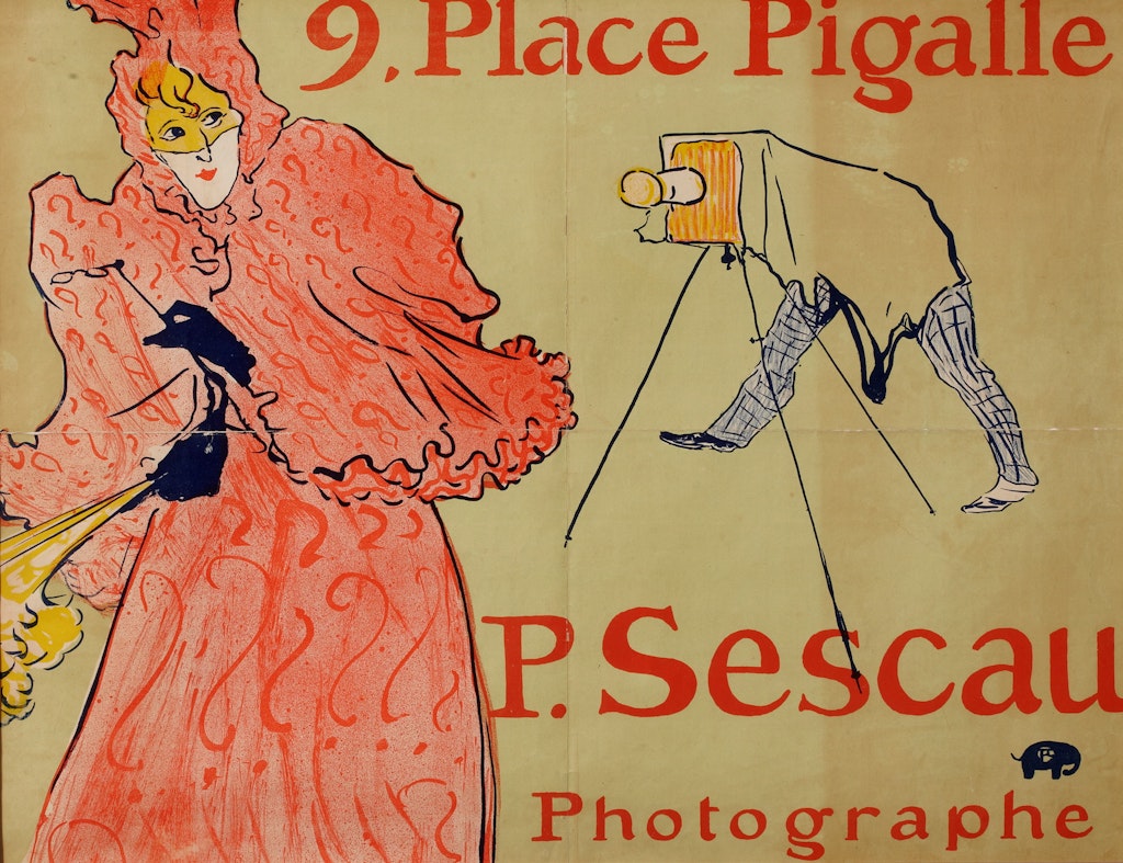 A person wearing a frilled orange dress, cape and headwear is photographed by a person leaning under cover of a camera on a tripod. Text reads '9. Place Pigalle / P. Sescau / Photographe'.