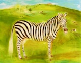 A zebra stands in a green field with cows on a hill behind.