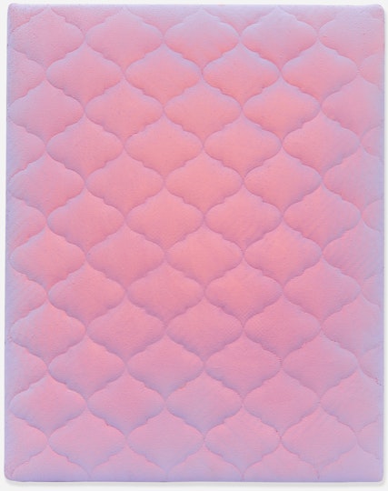 A bed mattress painted in pinkish purple.