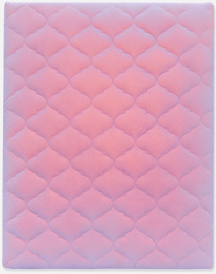 A bed mattress painted in pinkish purple.