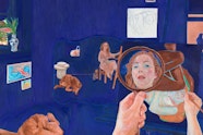 The face of the artist is visible in a handheld mirror in the foreground while the background shows them sitting in a blue room surrounded by various objects