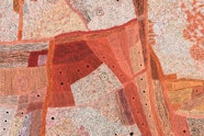 An Aboriginal painting of Country, using mainly shades of orange and brown.