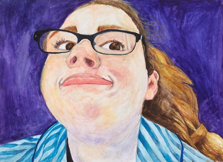 A person wearing glasses pulling a funny face