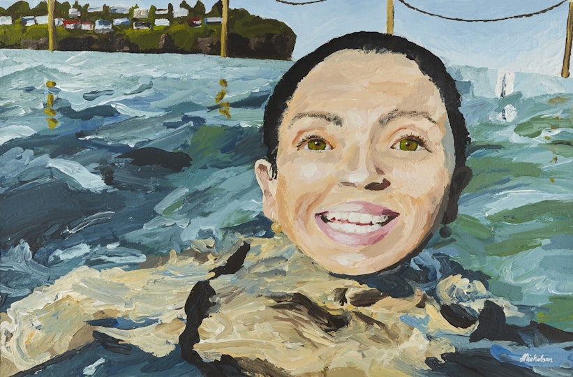 A smiling person in the ocean