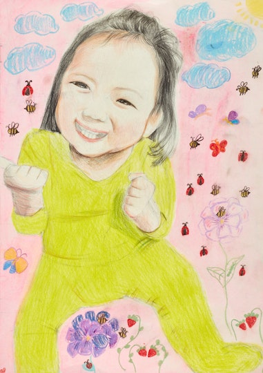 A seated child in a yellow body suit surrounded by plants and insects
