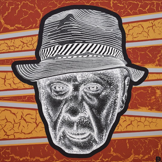 The head of a person wearing a hat on a striped background