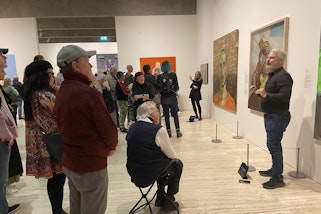 Sue Jo Wright and Todd Wright presenting an Auslan tour in the exhibition Archibald, Wynne and Sulman Prizes 2022