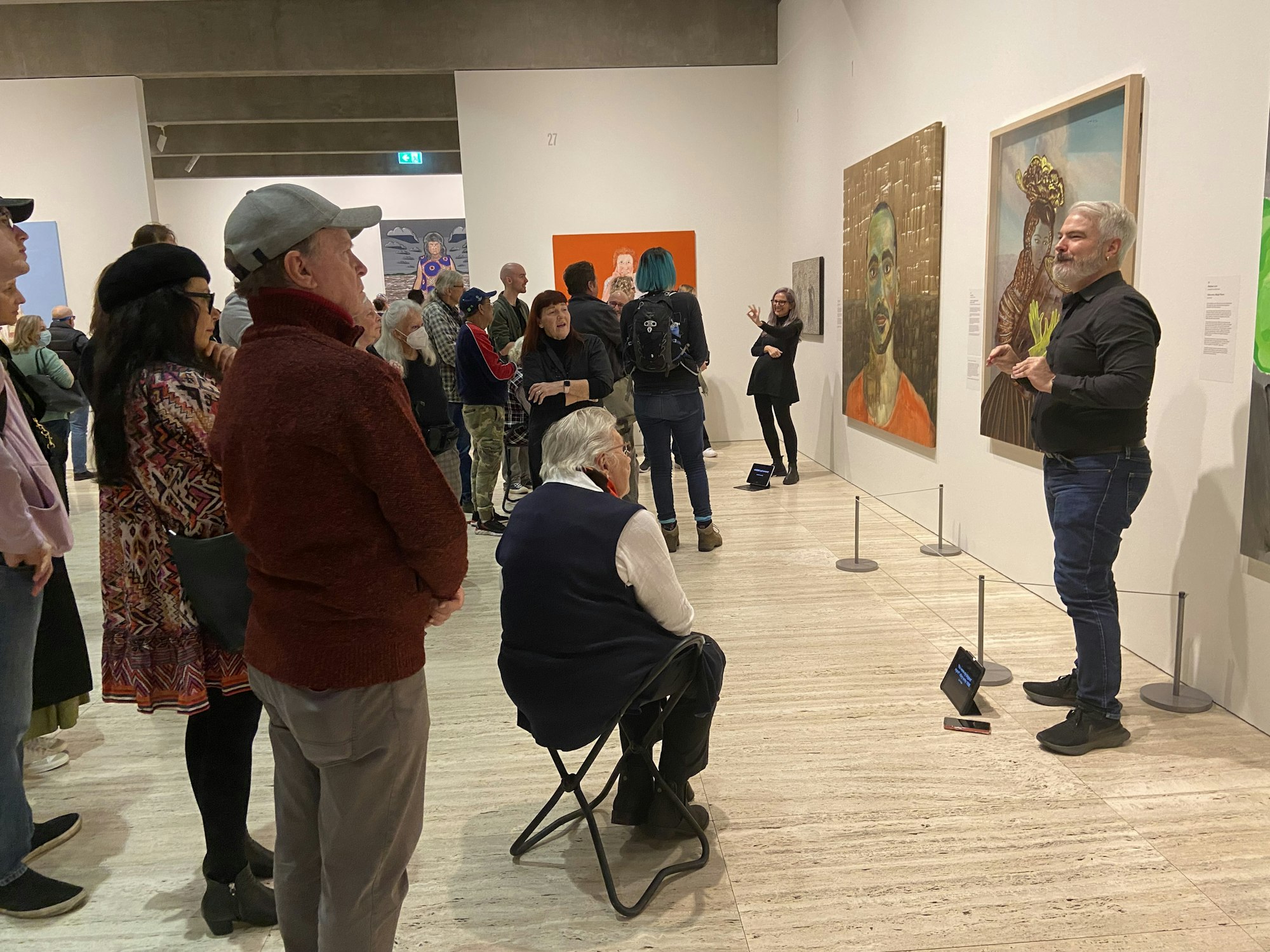 Sue Jo Wright and Todd Wright presenting an Auslan tour in the exhibition Archibald, Wynne and Sulman Prizes 2022