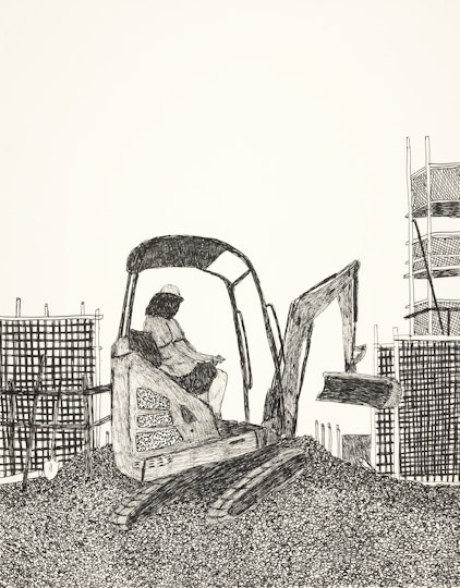 A person in a bulldozer on top of a mound with scaffolding in the background