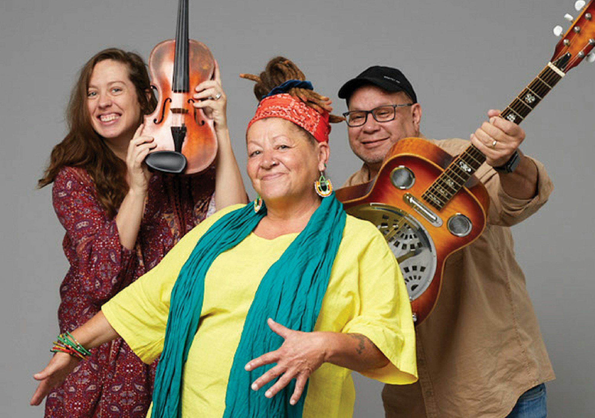 Three people: one holding a violin and one holding a guitar