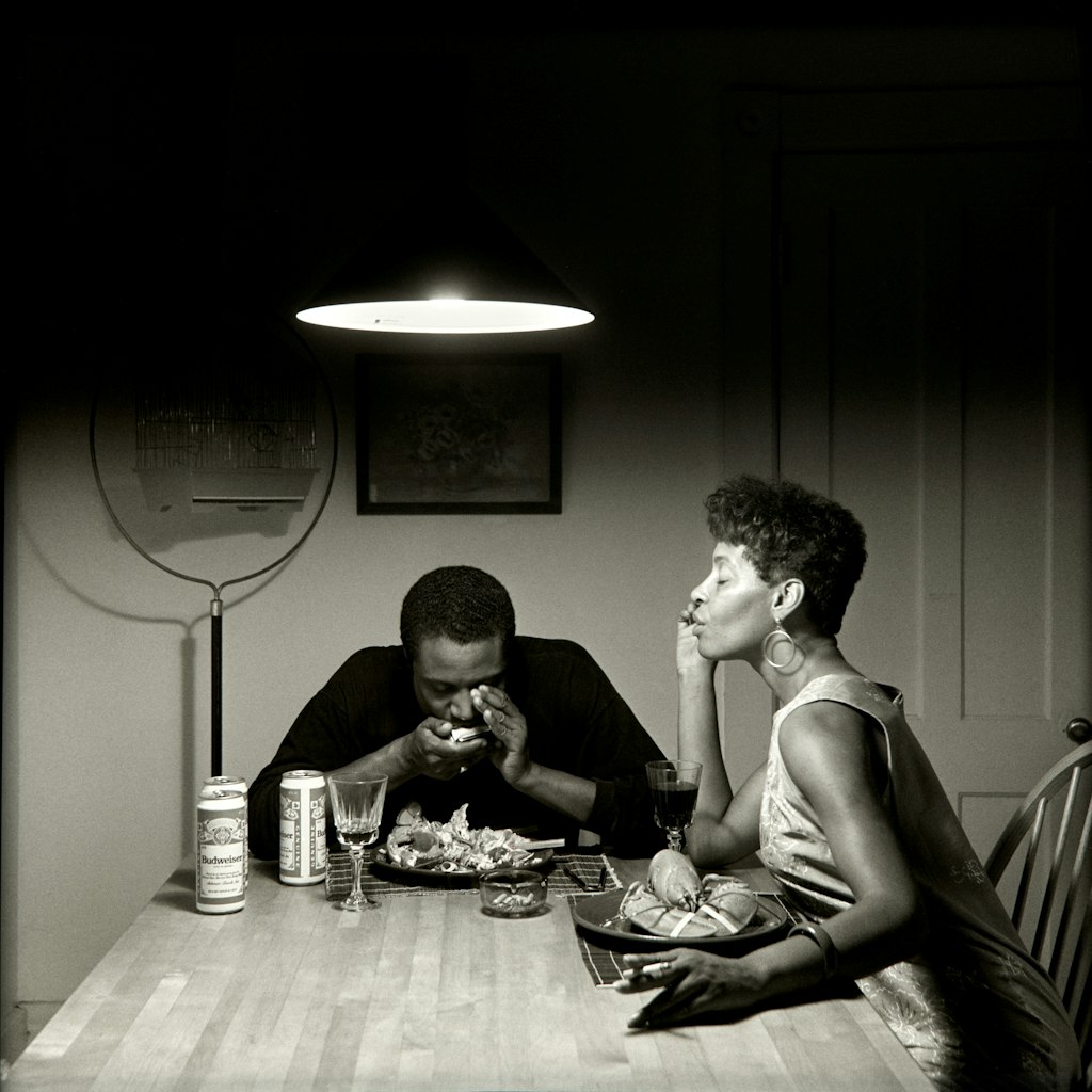 Carrie Mae Weems Untitled (playing harmonica) from The Kitchen Table Series 1990, Art Gallery of New South Wales © Carrie Mae Weems