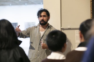 Gallery educator speaking with students at the Art Gallery of New South Wales