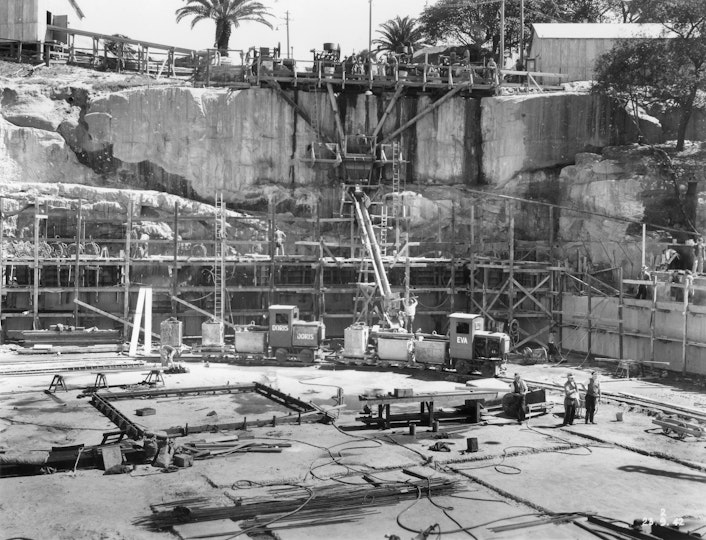 People and equipment on an excavated construction site