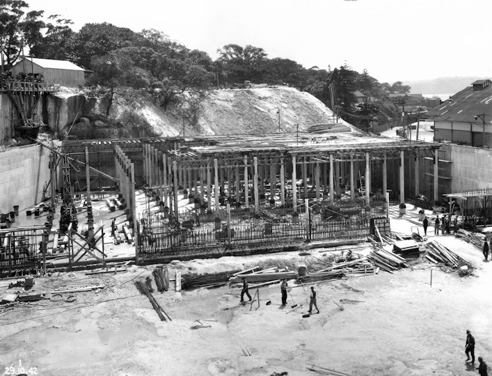 People, materials and equipment on a excavated construction site