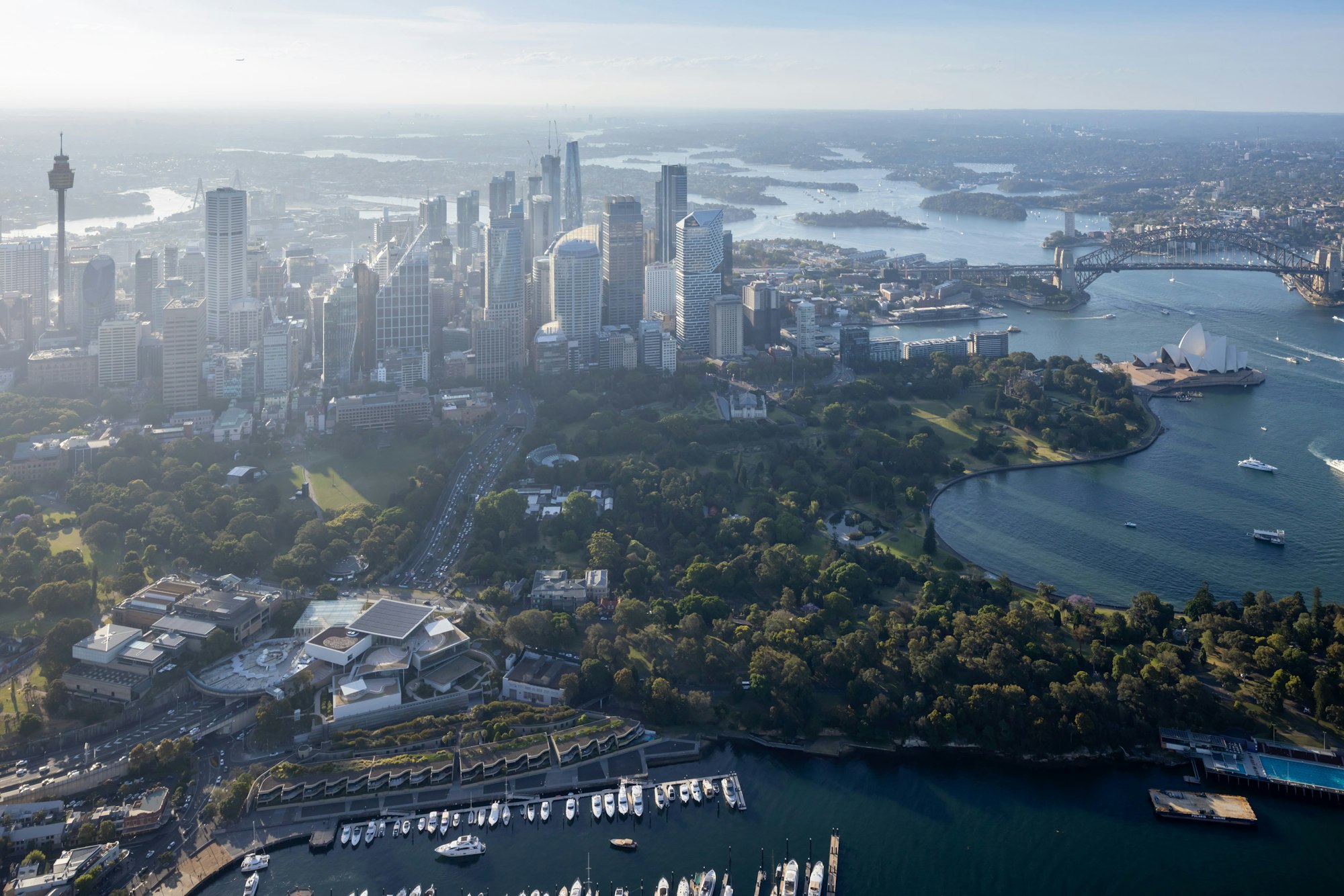 A view of the Sydney CBD, including the Art Gallery of New South Wales in the foreground and the Sydney Harbour Bridge and Sydney Opera House top right