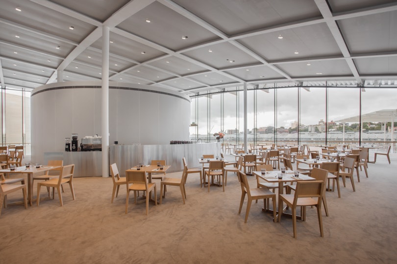 A dining space with four-seat square tables